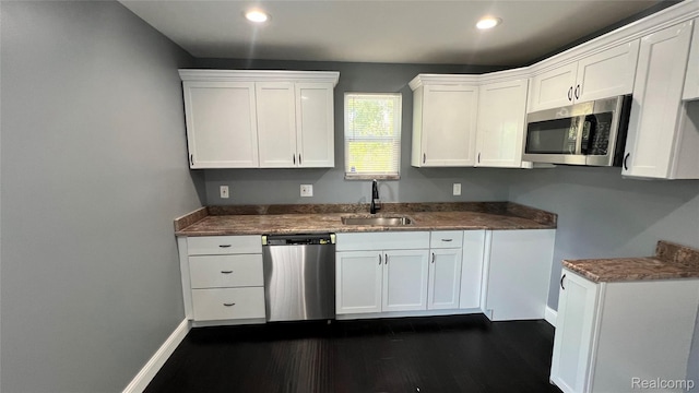 16535 Lamphere St, Detroit, MI 48219 - kitchen featuring stainless steel appliances, dark wood-style floors, white cabinets, recessed lighting, and dark countertops