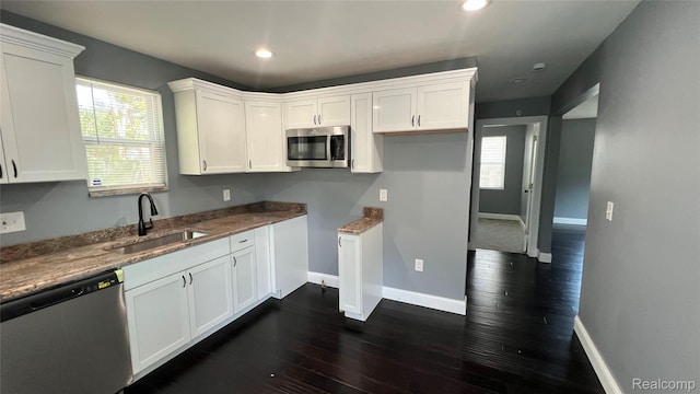 16535 Lamphere St, Detroit, MI 48219 - kitchen with stainless steel appliances, white cabinetry, dark wood-style flooring, recessed lighting, and stone countertops