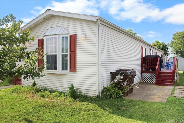 325 Yorkshire, Newport, MI 48166 - view of side of home featuring a deck, a yard, and a patio area