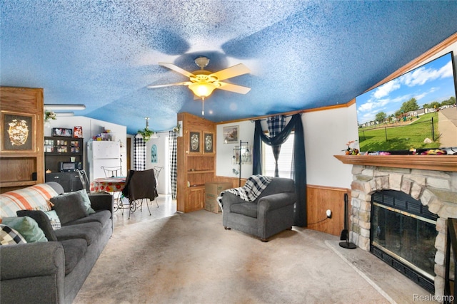 325 Yorkshire, Newport, MI 48166 - carpeted living room with ceiling fan, a wainscoted wall, a textured ceiling, wood walls, and a stone fireplace