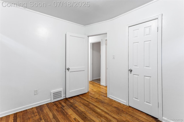 19132 Gilchrist St, Detroit, MI 48235 - unfurnished bedroom featuring baseboards and dark wood finished floors