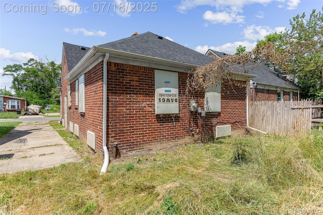 19132 Gilchrist St, Detroit, MI 48235 - view of home's exterior featuring brick siding and roof with shingles