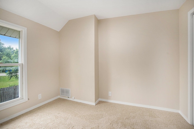 46 Walter Ave, Battle Creek, MI 49037 - spare room featuring light carpet and lofted ceiling