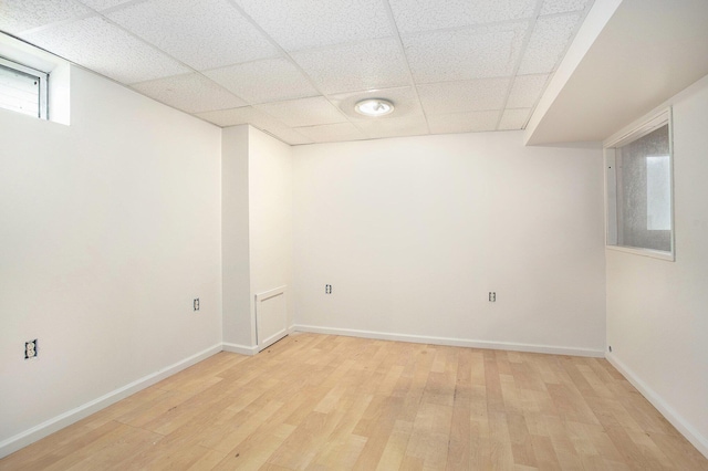 46 Walter Ave, Battle Creek, MI 49037 - basement featuring light wood-type flooring and a paneled ceiling