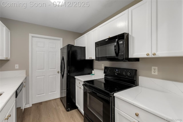 5548 Pine Aires Dr, Sterling Heights, MI 48314 - kitchen with black appliances, light wood-style flooring, and white cabinets