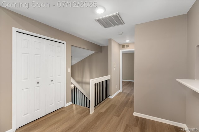 5548 Pine Aires Dr, Sterling Heights, MI 48314 - hall with an upstairs landing and wood finished floors