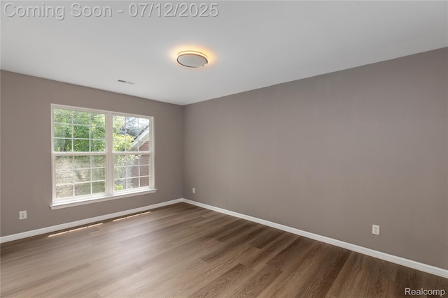 5548 Pine Aires Dr, Sterling Heights, MI 48314 - unfurnished room featuring wood finished floors and baseboards