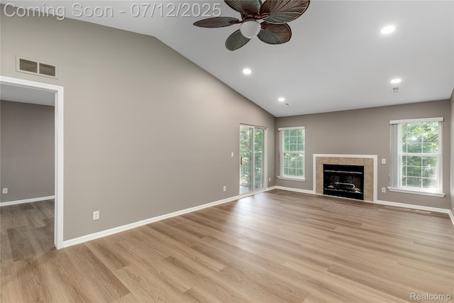 5548 Pine Aires Dr, Sterling Heights, MI 48314 - unfurnished living room featuring ceiling fan, high vaulted ceiling, light wood-type flooring, a tile fireplace, and recessed lighting