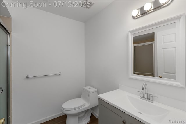 5548 Pine Aires Dr, Sterling Heights, MI 48314 - full bathroom with vanity, wood finished floors, and a shower with shower door