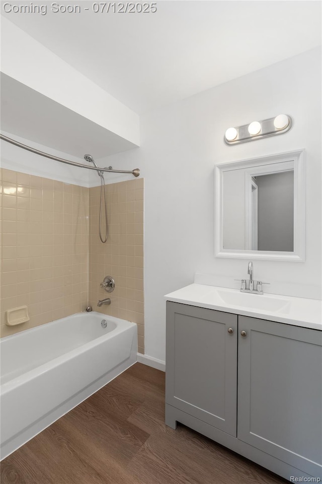 5548 Pine Aires Dr, Sterling Heights, MI 48314 - full bath featuring wood finished floors, shower / washtub combination, and vanity