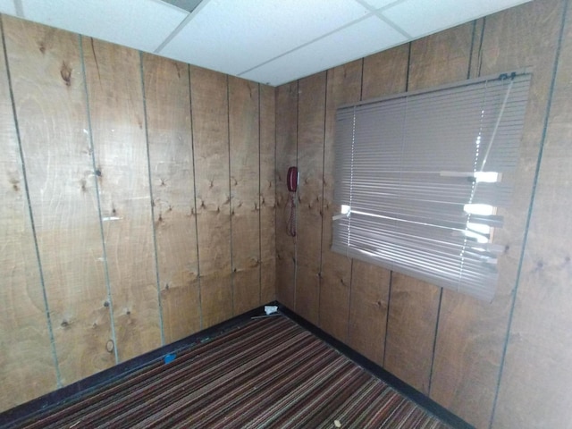 3539 14th St, Wyandotte, MI 48192 - spare room featuring wooden walls