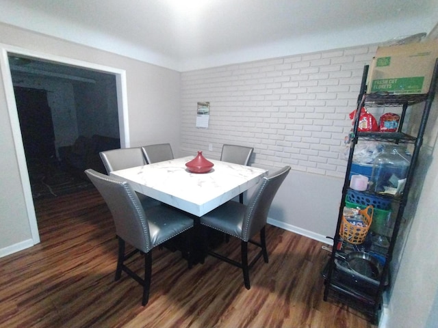 3539 14th St, Wyandotte, MI 48192 - dining space featuring wood finished floors and brick wall