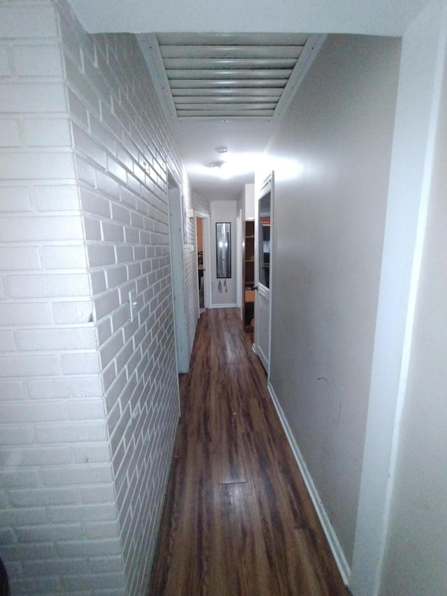 3539 14th St, Wyandotte, MI 48192 - corridor featuring dark wood finished floors and brick wall