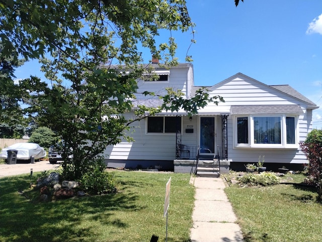3539 14th St, Wyandotte, MI 48192 - view of front facade with a front yard