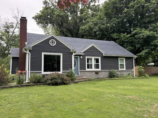 2728 Brook Dr, Kalamazoo, MI 49004 - view of front of home featuring roof with shingles, a chimney, and stone siding