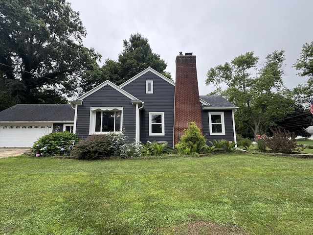 2728 Brook Dr, Kalamazoo, MI 49004 - view of front facade featuring a chimney, a front lawn, a garage, and concrete driveway