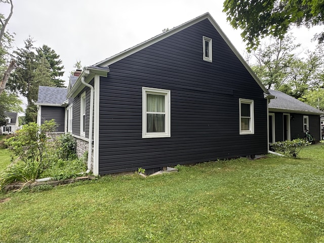 2728 Brook Dr, Kalamazoo, MI 49004 - view of side of home with a yard and a chimney