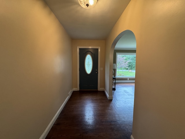 2728 Brook Dr, Kalamazoo, MI 49004 - doorway with arched walkways and dark wood-style floors