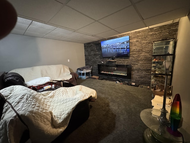 2728 Brook Dr, Kalamazoo, MI 49004 - carpeted living area featuring a drop ceiling and a glass covered fireplace