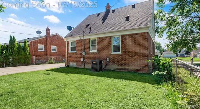 2606 Willow St, Dearborn, MI 48124 - back of house with a shingled roof and brick siding