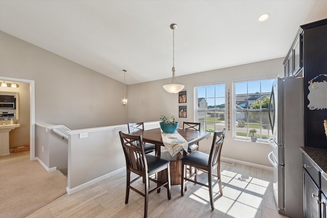 58852 Silvergrass Dr, Mattawan, MI 49071 - dining room featuring lofted ceiling and light wood-type flooring