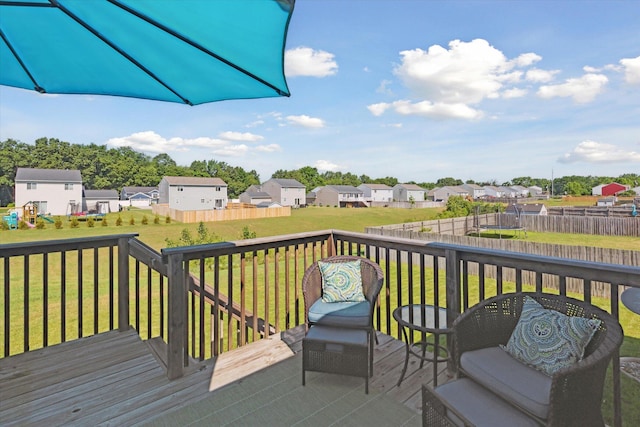 58852 Silvergrass Dr, Mattawan, MI 49071 - wooden terrace with a trampoline, a residential view, and a fenced backyard