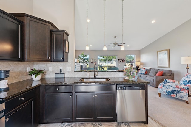 58852 Silvergrass Dr, Mattawan, MI 49071 - kitchen featuring dishwasher, open floor plan, dark stone counters, a ceiling fan, and a peninsula