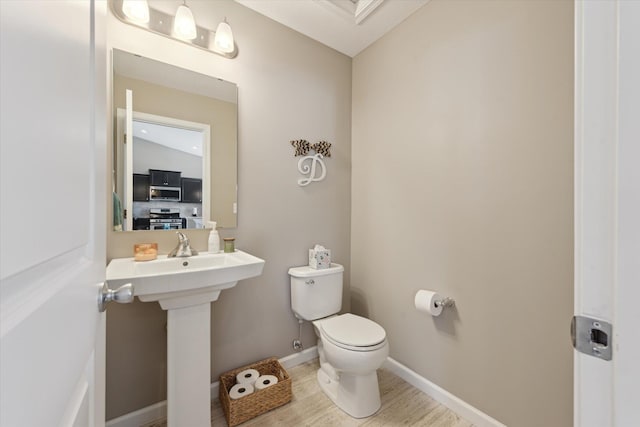 58852 Silvergrass Dr, Mattawan, MI 49071 - bathroom with toilet and wood finished floors
