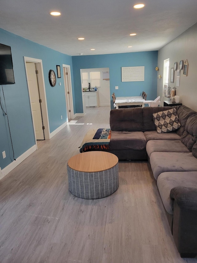 1211 Howard Ave, Muskegon, MI 49442 - living room featuring wood finished floors and recessed lighting