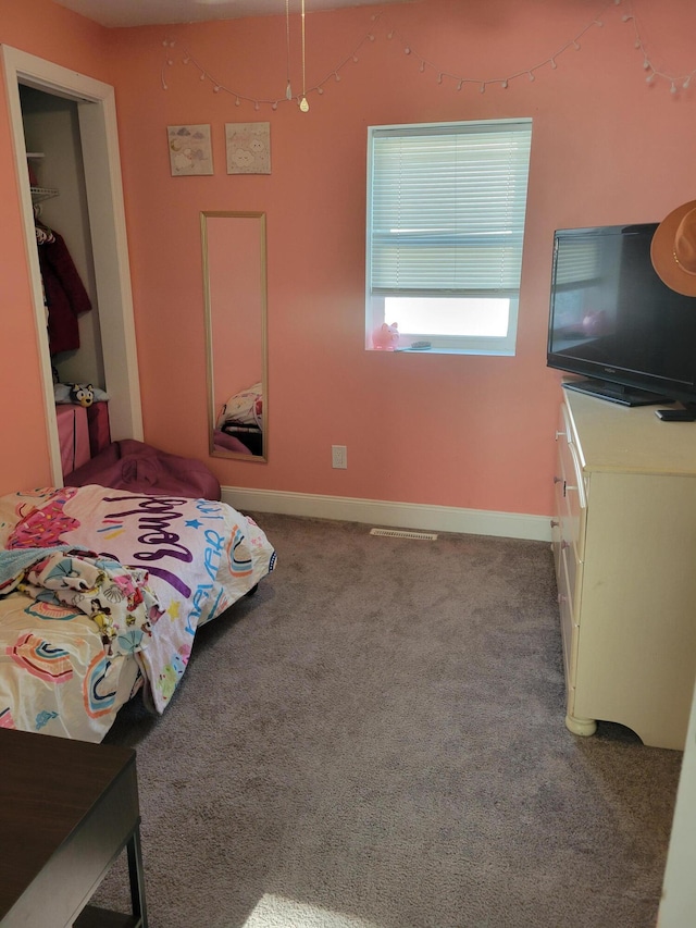 1211 Howard Ave, Muskegon, MI 49442 - carpeted bedroom featuring baseboards