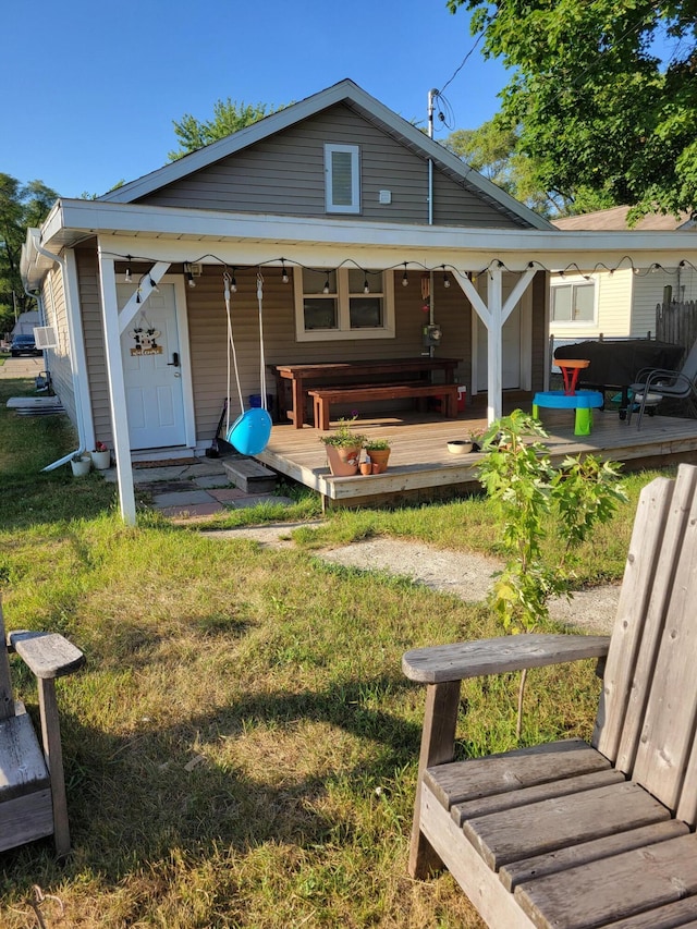 1211 Howard Ave, Muskegon, MI 49442 - back of house featuring a lawn