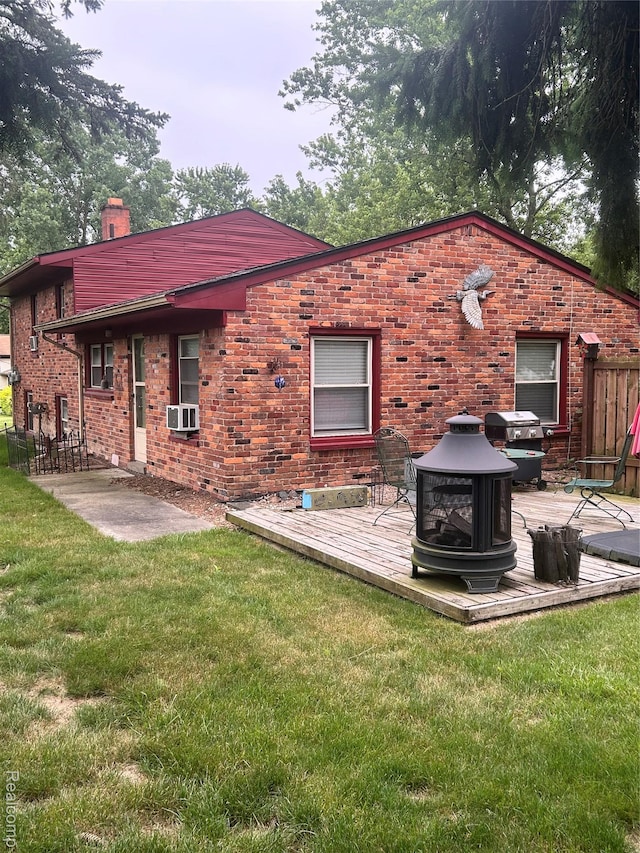 305 Goldengate St, Lake Orion, MI 48362 - rear view of house with a chimney, a yard, brick siding, and a wooden deck