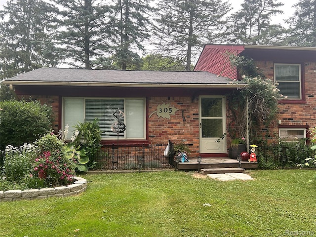 305 Goldengate St, Lake Orion, MI 48362 - view of front facade with brick siding and a front yard