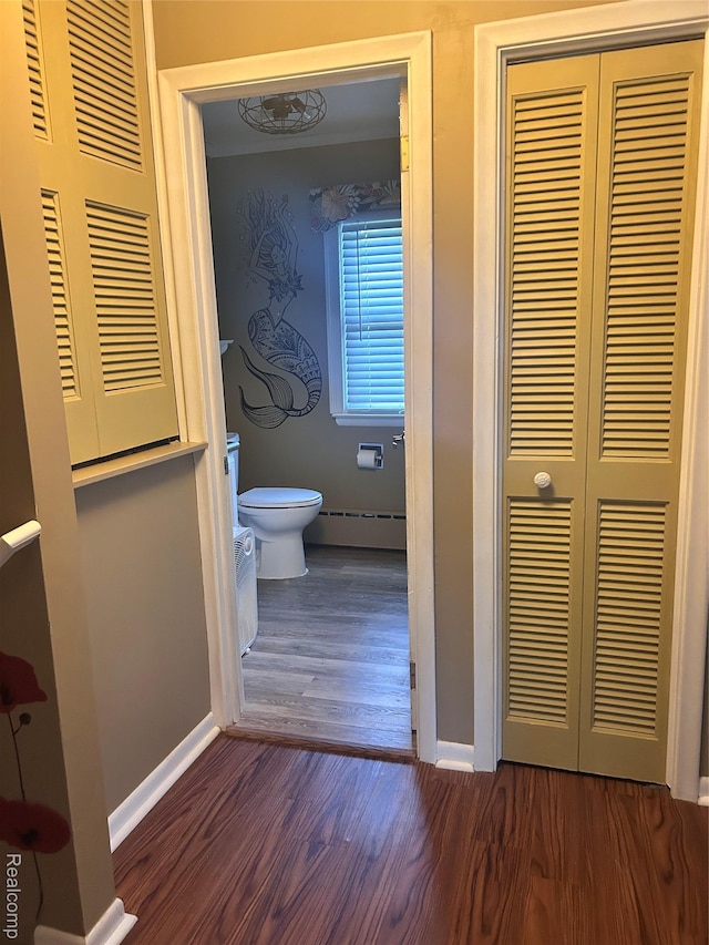 305 Goldengate St, Lake Orion, MI 48362 - bathroom with wood finished floors, baseboard heating, and a closet