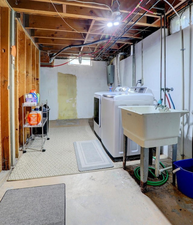 1441 Lewison Ave NE, Grand Rapids, MI 49505 - basement with washer and clothes dryer and water heater