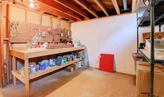 1441 Lewison Ave NE, Grand Rapids, MI 49505 - unfinished basement with a workshop area
