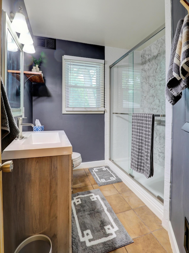1441 Lewison Ave NE, Grand Rapids, MI 49505 - bathroom with a stall shower, vanity, and tile patterned flooring
