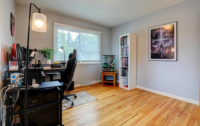 1441 Lewison Ave NE, Grand Rapids, MI 49505 - home office with wood finished floors and baseboards