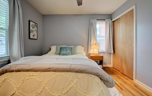 1441 Lewison Ave NE, Grand Rapids, MI 49505 - bedroom featuring light wood-type flooring, a closet, and ceiling fan