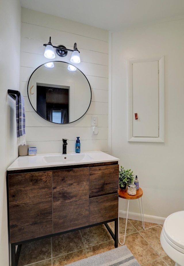 1441 Lewison Ave NE, Grand Rapids, MI 49505 - half bathroom featuring vanity and wood walls