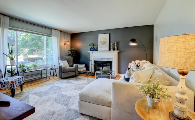1441 Lewison Ave NE, Grand Rapids, MI 49505 - living room with wood finished floors and a fireplace with flush hearth