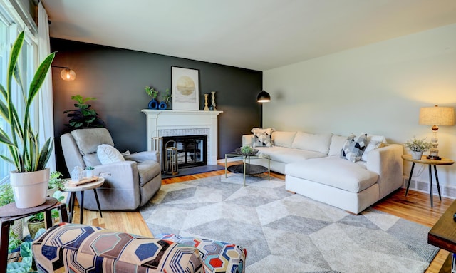 1441 Lewison Ave NE, Grand Rapids, MI 49505 - living room with wood finished floors and a glass covered fireplace