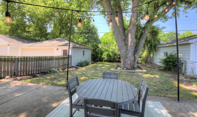 1441 Lewison Ave NE, Grand Rapids, MI 49505 - fenced backyard with a patio and outdoor dining area