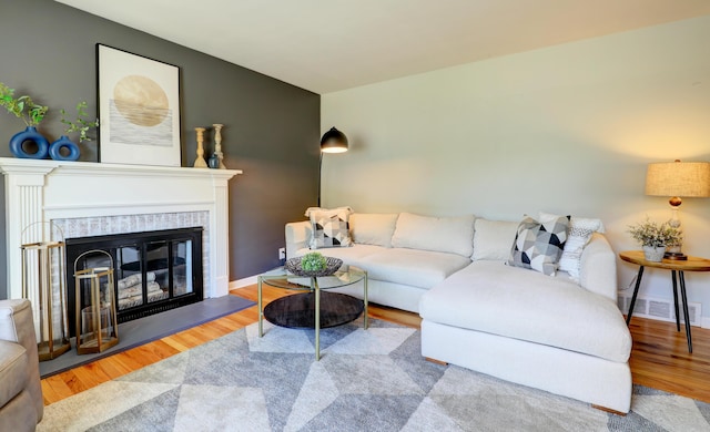 1441 Lewison Ave NE, Grand Rapids, MI 49505 - living area featuring wood finished floors and a fireplace