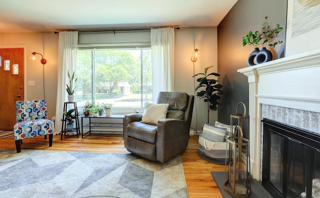 1441 Lewison Ave NE, Grand Rapids, MI 49505 - living area with a tile fireplace and light wood-type flooring