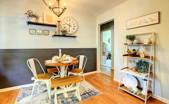 1441 Lewison Ave NE, Grand Rapids, MI 49505 - dining room featuring a chandelier and wood finished floors