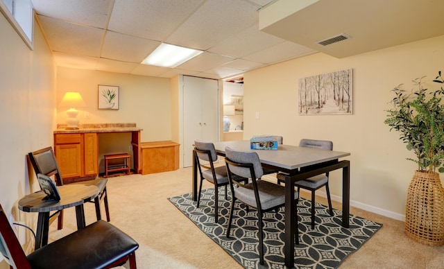 1441 Lewison Ave NE, Grand Rapids, MI 49505 - dining area featuring light colored carpet and a paneled ceiling