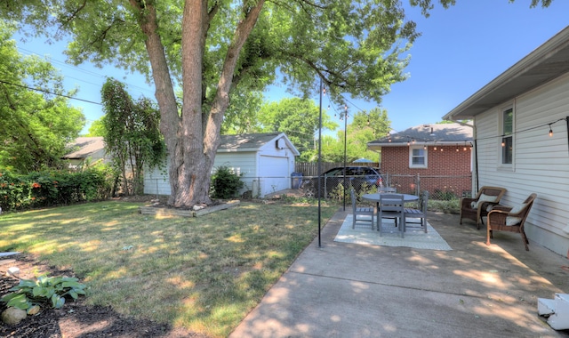 1441 Lewison Ave NE, Grand Rapids, MI 49505 - fenced backyard featuring a patio and outdoor dining area