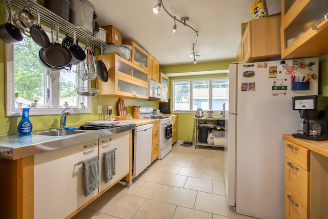 31124 Geraldine St, Westland, MI 48185 - kitchen with white appliances, stainless steel counters, light tile patterned flooring, glass insert cabinets, and track lighting