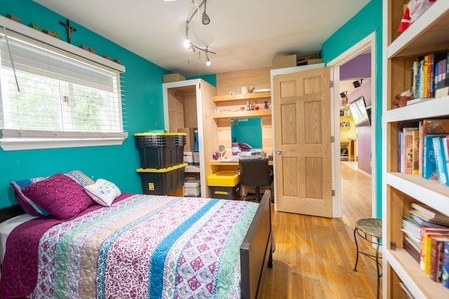 31124 Geraldine St, Westland, MI 48185 - bedroom featuring wood finished floors, an office area, and track lighting